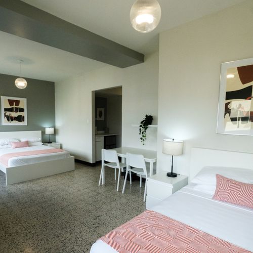 This well-arranged studio combines comfort with functionality, featuring a cozy bed and a convenient desk area, perfect for both leisure and work.