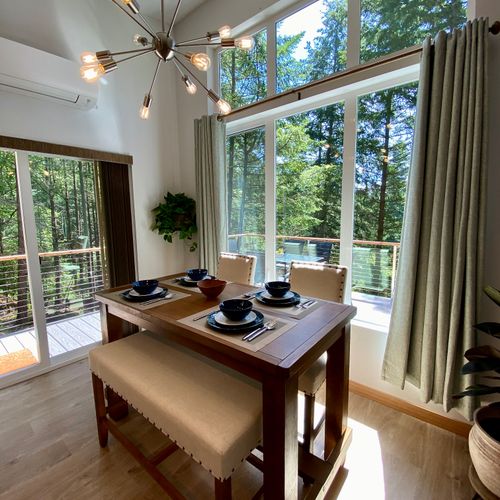 Dine beneath a stunning Sputnik chandelier with the Orcas Island forest as your backdrop — indoors never felt so outdoors.