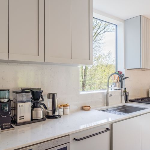 A picture window thoughtfully placed above the kitchen sink.