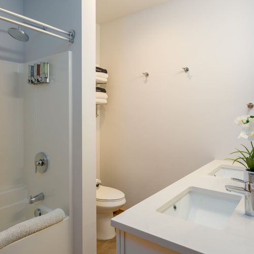 Fresh towels, clean lines, and everything you need — a calm, well-appointed bathroom to start and end your day right.