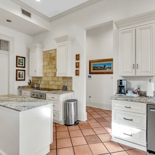 Elegant kitchen with granite counters and modern amenities.