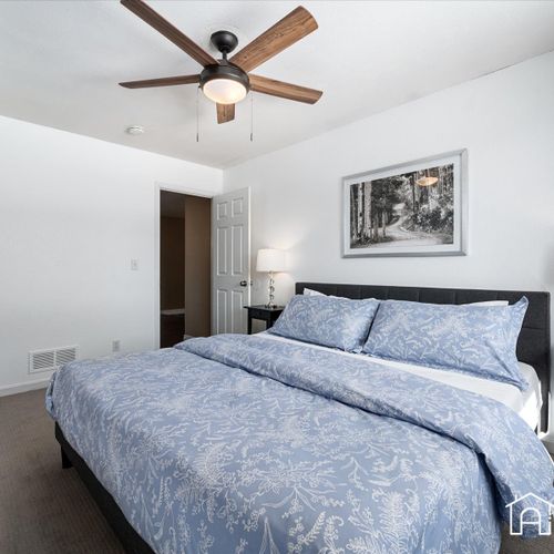 Unwind in style in the upstairs master bedroom, complete with a comfortable king-size bed, air mattress for extra guests and ample space.