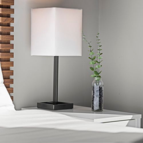 Bedside table with lamp and charging access