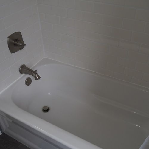 Bathroom #2 (upstairs):  there is a full bathroom upstairs with a combination bathtub / shower, toilet, vanity, sink, and mirror.