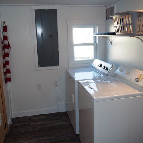 Laundry room:  main floor laundry room with washer, dryer, and sink.