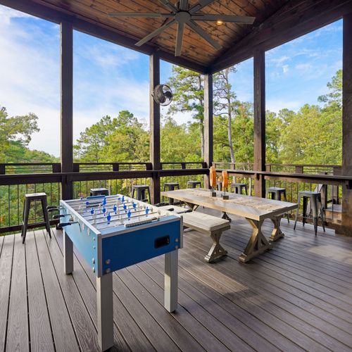 The outdoor amenities don't stop there...challenge your crew to a foosball match surrounded by views of the forest.