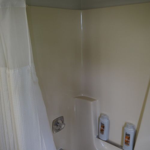 Guest bathroom:  this is a full bathroom that has a common entrance. It includes a combination tub and shower.