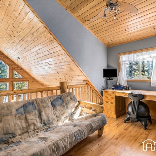 - upstairs loft features a comfortable futon and a spacious work desk under wood ceilings
- ideal remote work setup with natural lighting, privacy, and nature views
- relax, read, or focus in a quiet space that’s both cozy and functional