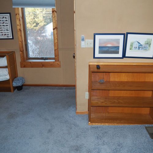 Bedroom #4 (second floor):  features a queen-size bed, private television, sofa bed, comfy chair, ceiling fan, baby crib, and a dresser.