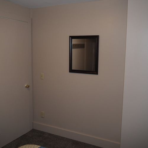 Bedroom #2:  features 2 twin beds, window a/c unit, nightstand, lamp, and mirror.