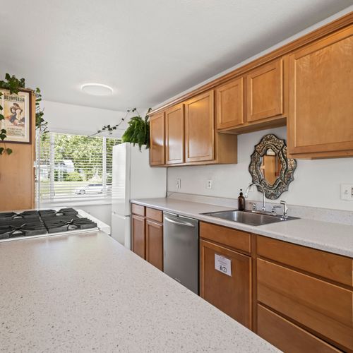 Fresh mornings start here—light, space, and charm fill this well appointed kitchen.