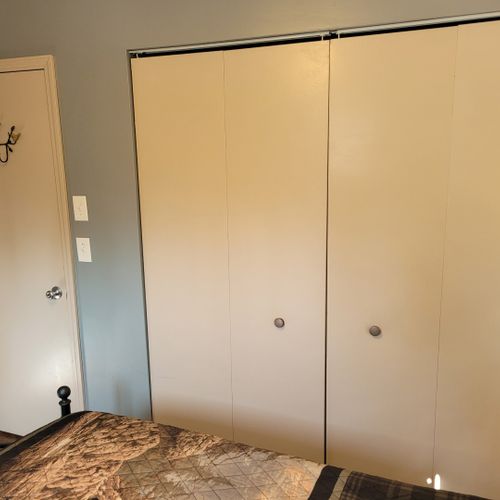 Bedroom #2 (second floor):  features a queen-size bed, nightstands, lamps, and a closet.