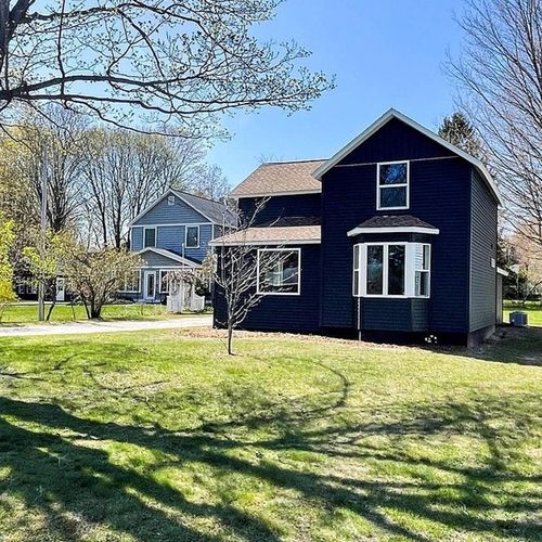 EXETERIOR:  The front of the house in Spring