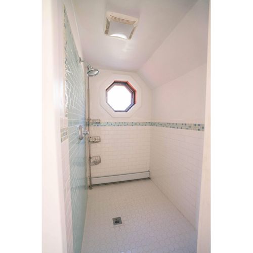 Separate shower room and powder room on 1st floor between kitchen and living room