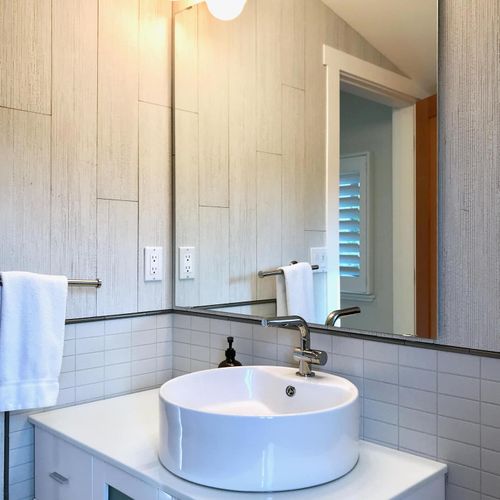 Half bathroom on the upper living room level of the home