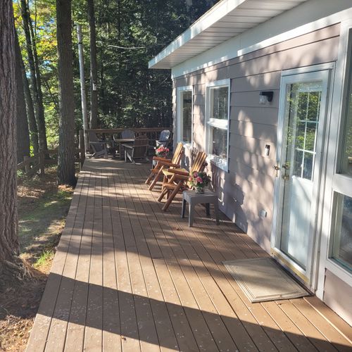 EXTERIOR:  The large and gorgeous backyard deck facing Crystal Lake