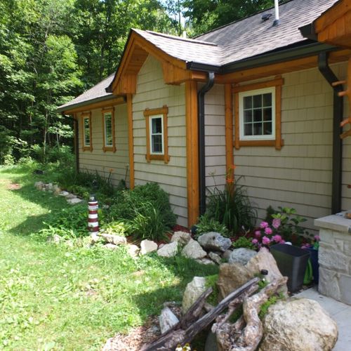 Exterior:  a closer view of the front of the house. The outdoor propane gas grill that is available for guests to use is shown in the photo as well.