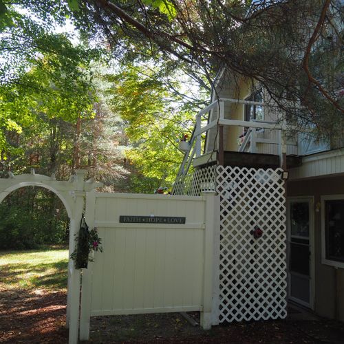 Exterior:  the private entrance to the backyard and stairs to the apartment.