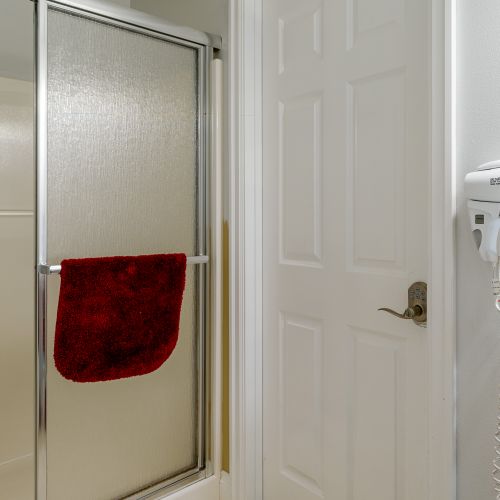 A shower/tub combo makes showering easy for hot tub users and the Raven Room guest.