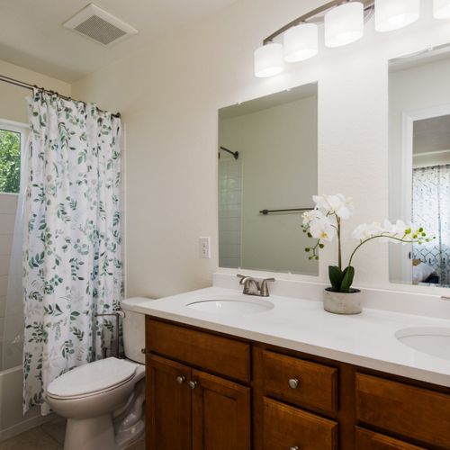 The master bathroom consists of a tub/shower combo and double vanity. Towels and toiletries are provided for your convenience.