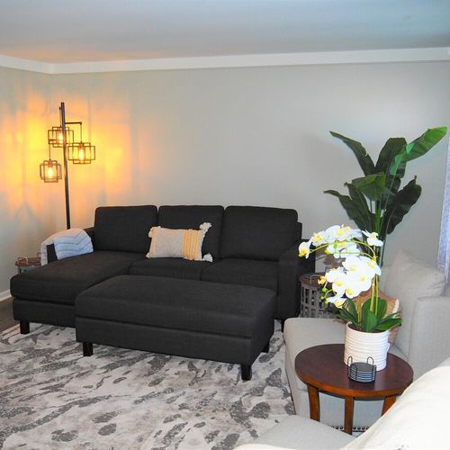 Living room:  very comfy and cozy living room with a sofa, comfy chairs, large television with living streaming, and a very cool electric fireplace.