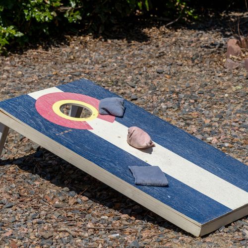 Challenge your crew to a classic cornhole showdown in the backyard.