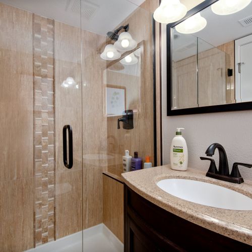 Enjoy the convenience of provided toiletries and towels in all of our bathrooms, two of which feature walk-in glass door showers