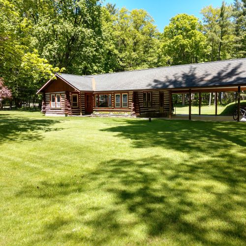 Overall:  the front of the cabin in summer.