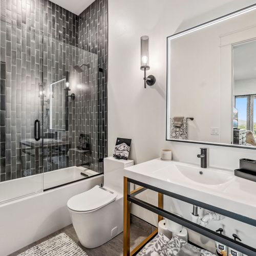 Unwind in the tub surrounded by serene, spa-like finishes.