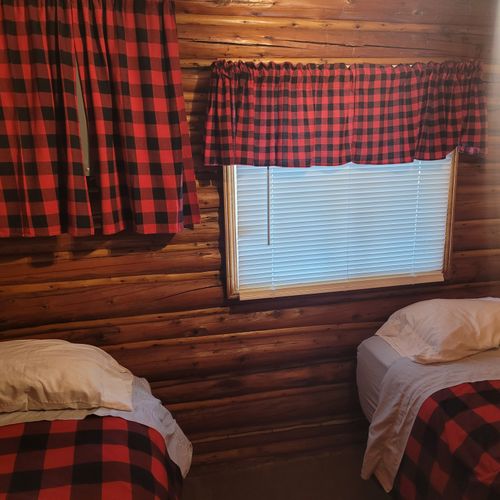 Bedroom #2:  features 2 twin size beds, nightstand, lamp, closet, and dresser