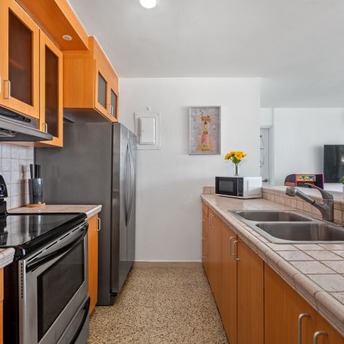 Functional kitchen setup ideal for meal preparation, with all essential appliances and a clean, organized layout.