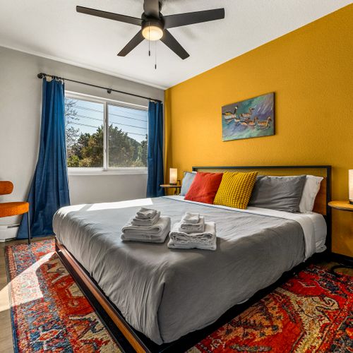 Get restful sleep in this crisp, uncluttered bedroom thoughtfully designed with small details that make a big impact.
