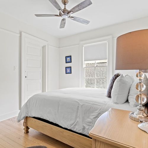 Bright first bedroom w/ closet storage.