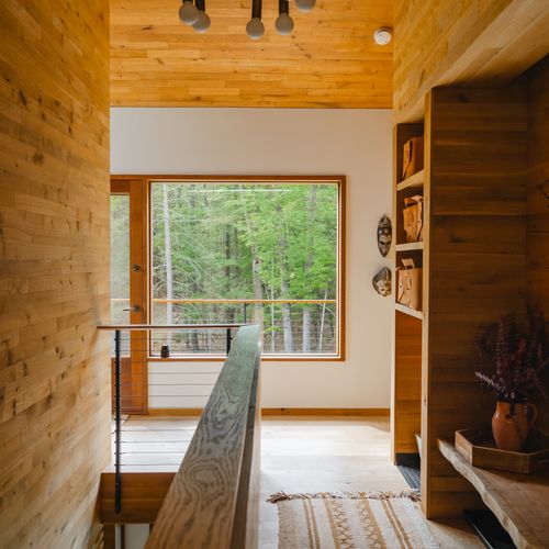 Warm wood tones throughout the entryway