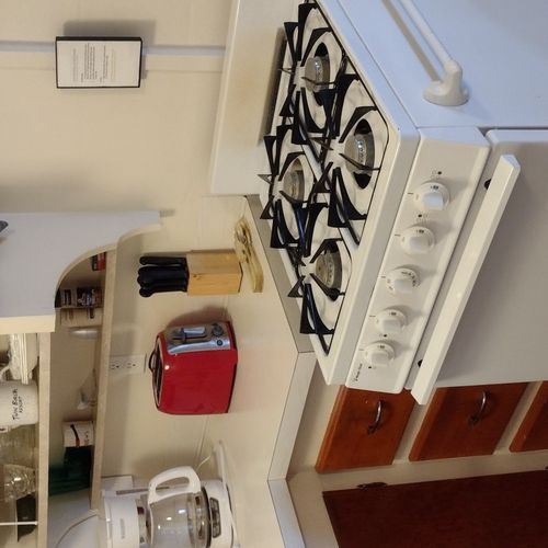 Kitchen:  the cabin has a modern and fully-functional kitchen with a refrigerator, sink, gas range, and a good collection of cooking and dining utensils.