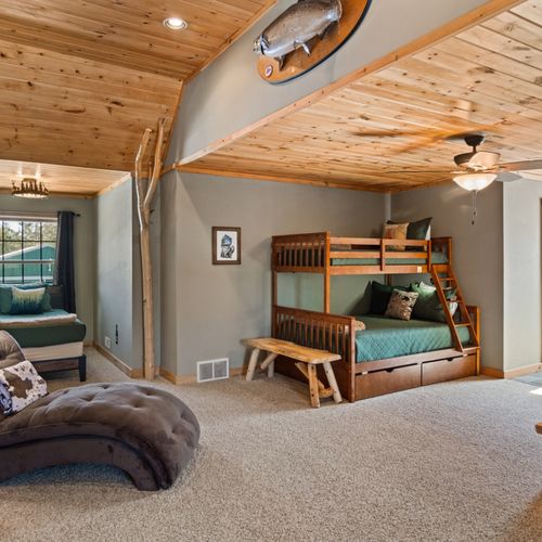 Loft:  features 2 twin-on-full bunk beds, twin bed, futon, television, and full bathroom.