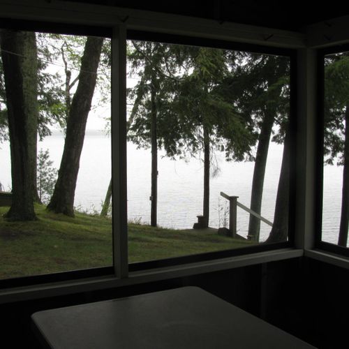Front porch:  the cabin has a lovely screened-in porch with a picnic table and a great view of little platte lake