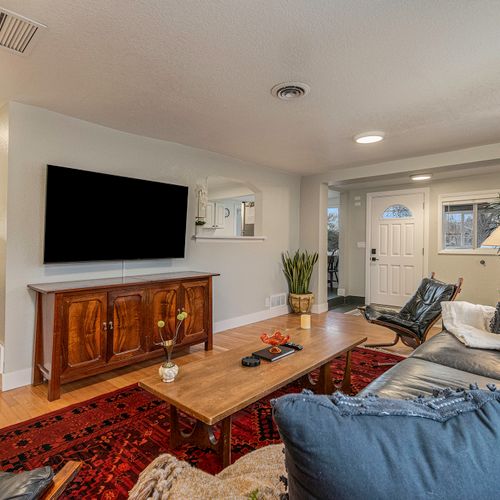 Kick back and relax in the inviting living area - complete with cozy seating, modern decor, and a smart tv.