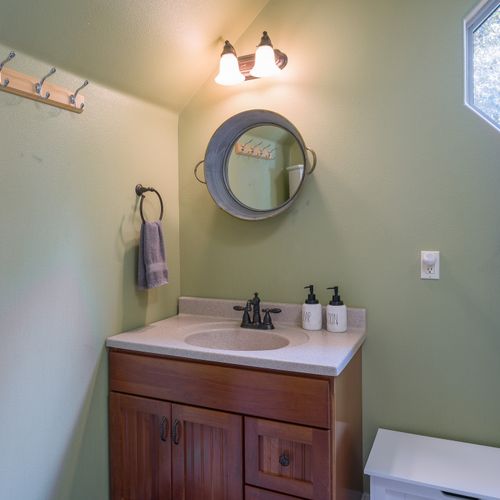 Studio has a full bathroom with custom tile and linens