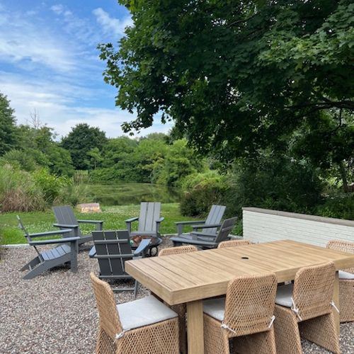 Enjoy the outdoor dining area and fire pit.