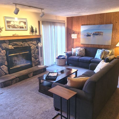 LIVING ROOM:  The large and beautiful living room with walk-out to the bonfire ring.  (Note that the fireplace is not available for guest usage.)