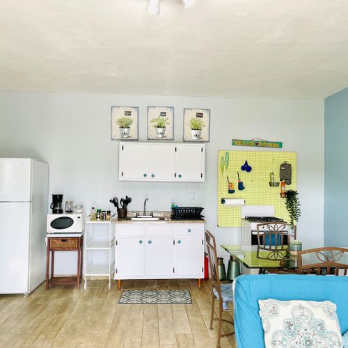 Enjoy the freedom of home-cooked meals! Our compact yet complete kitchen provides all the essentials, from a full-size fridge to a stove, making dining in a breeze."