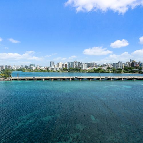 Immerse yourself in the beauty of San Juan with unparalleled views of the iconic Condado Lagoon.
