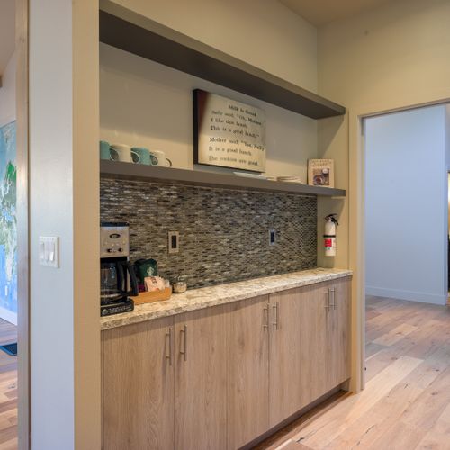 We have a drip coffee maker, french press, coffee grinder, coffee bar, Cuisinart food processor, blender, and dishwasher.