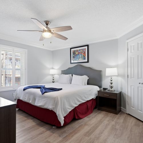 Calm, neutral bedroom w/ a crisp bed ready for deep rest.