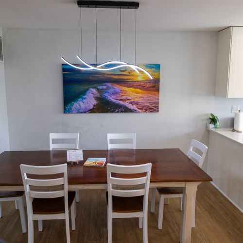 The dining area comfortable seating for up to 6 guests, offering a warm and inviting ambiance for meals and gathering.