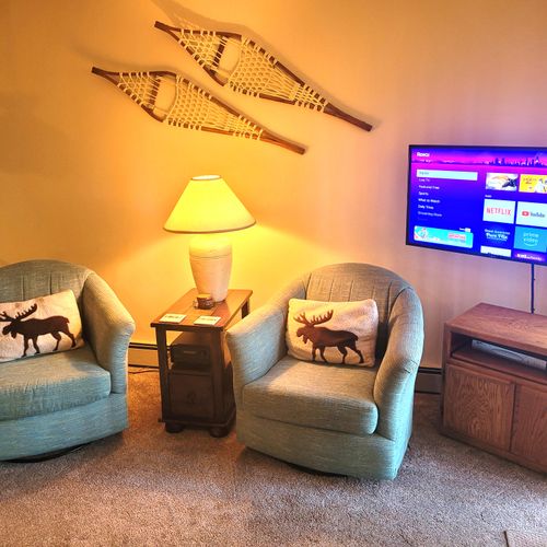 LIVING ROOM:  The large and beautiful living room with walk-out to the bonfire ring.  (Note that the fireplace is not available for guest usage.)