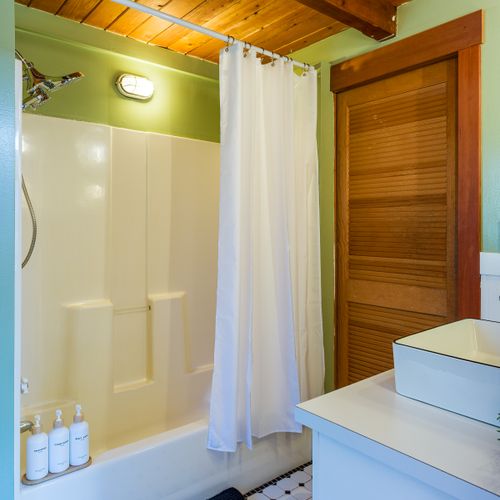 Shower and tub combo allow for post-hike soaking and self-care.