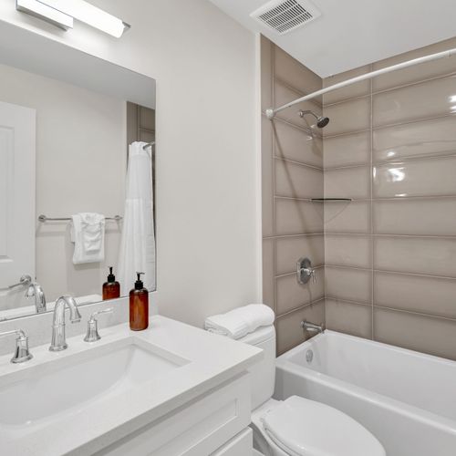 Full bath w/ tub, modern fixtures & fresh linens for a comfortable stay.