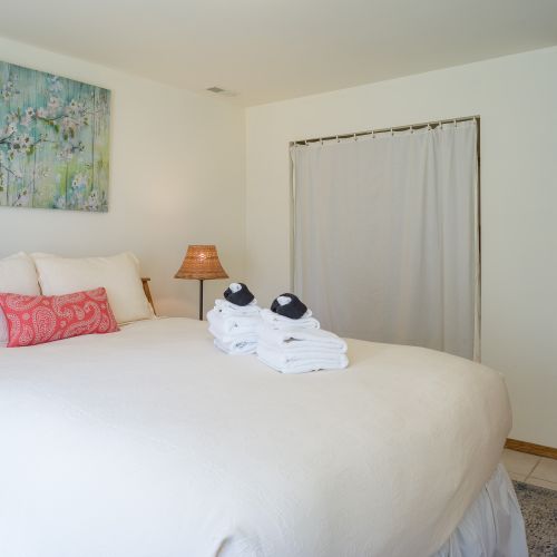 Guest bedroom with full bathroom ensuite and large closet.